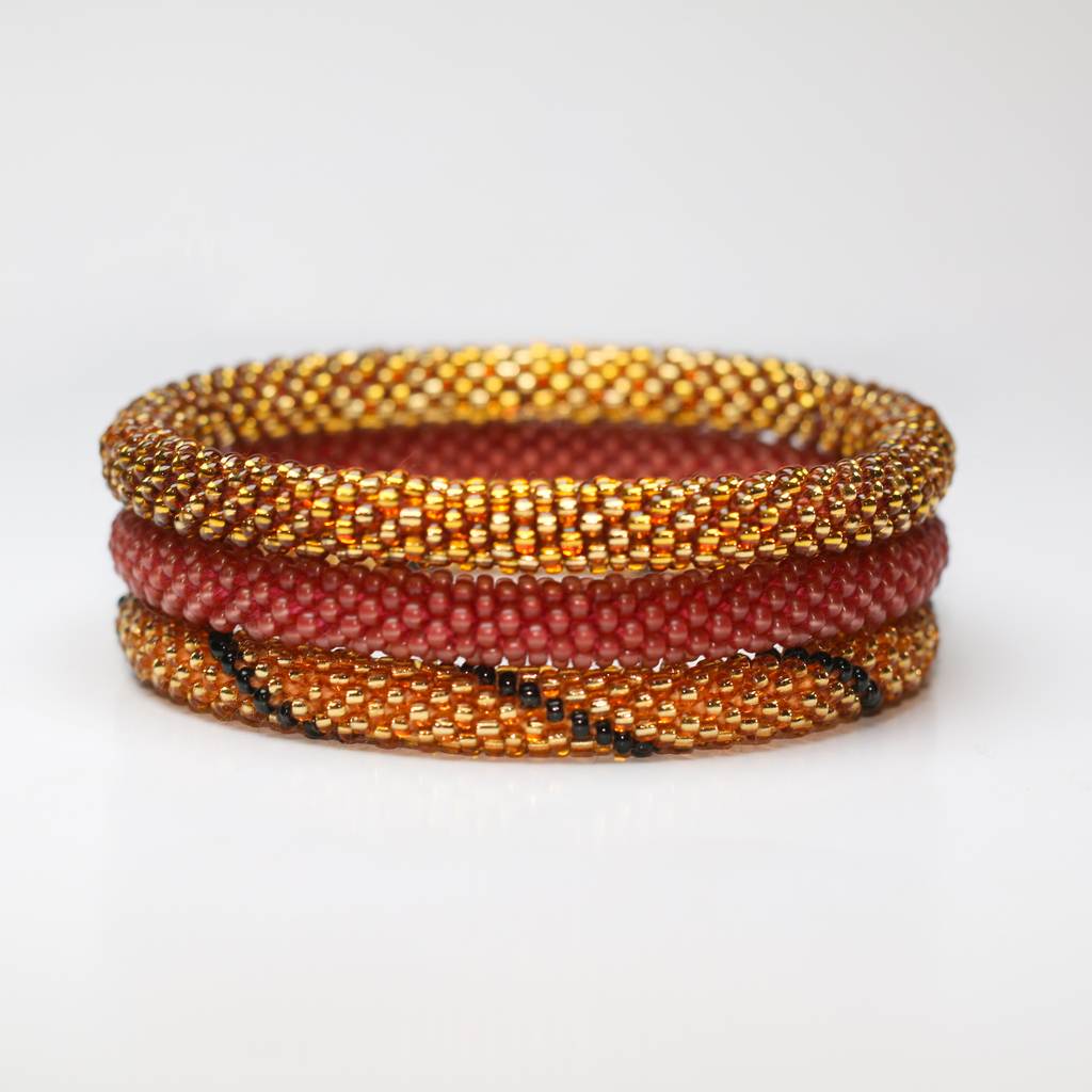 ROLL-ON PERLEARMBÅND FRA NEPAL - Klar guld med sort detalje