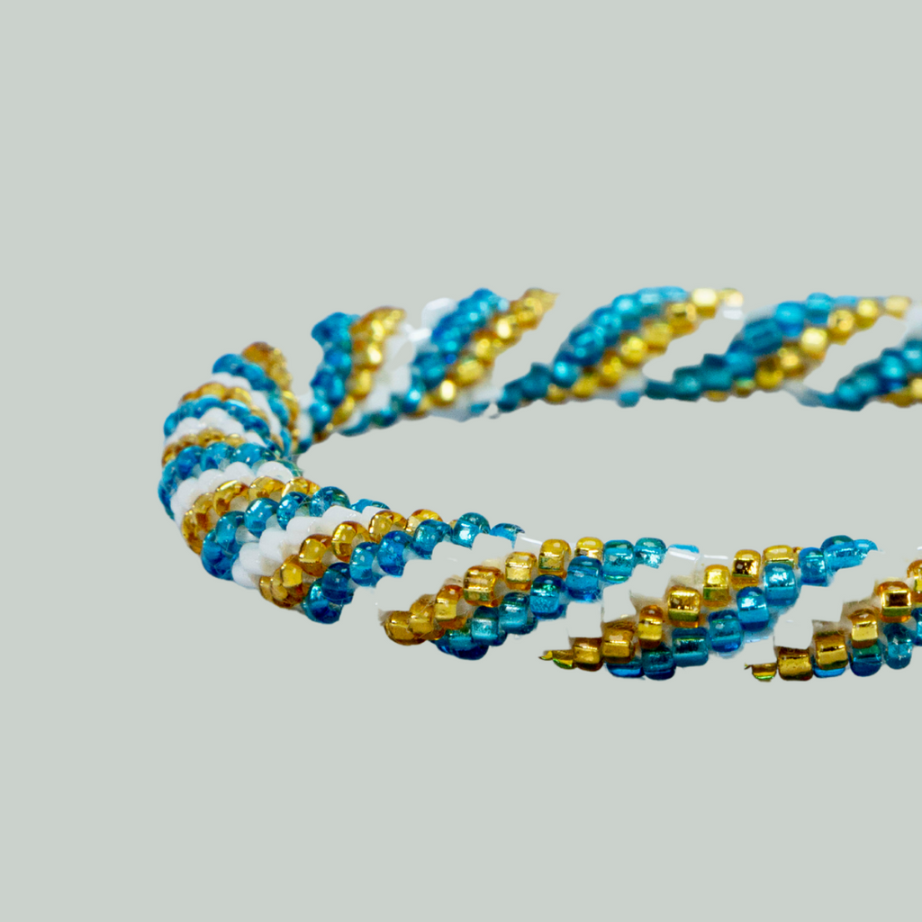 ROLL-ON PERLEARMBÅND - Guld, blå og hvide striber